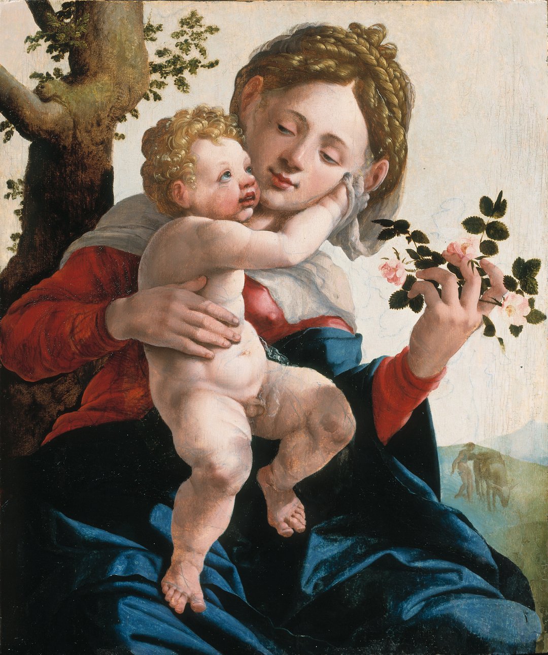 Renaissance schilderij 'Madonna met wilde rozen', waarop Maria liefdevol een naakte Christuskind omarmt. Beiden met gouden haar, terwijl Maria een tak met wilde roze rozen vasthoudt tegen een landschapsachtergrond.